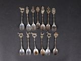 a lot of spoons that are sitting on a table