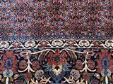 an oriental rug on a wooden floor in a room