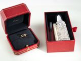 a red box with a silver ring inside of it