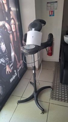 a hair dryer that is on a stand in a room