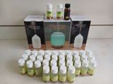 several bottles of essential oils sitting on a counter top next to a box of essential oils