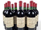 six bottles of red wine are lined up in a row