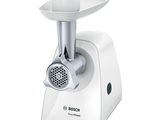 the white electric meat grinder is sitting on a white surface