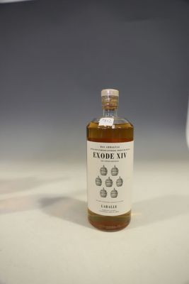 an image of a bottle of alcohol sitting on top of a table