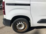 a white van that is parked in a parking lot