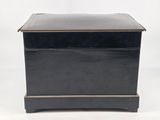 a black wooden box with a lid on a white background