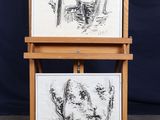 two drawings of a man and a woman on a easel