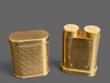 two lighters sitting next to each other on a gray surface