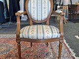 a chair that is sitting on a rug in a room