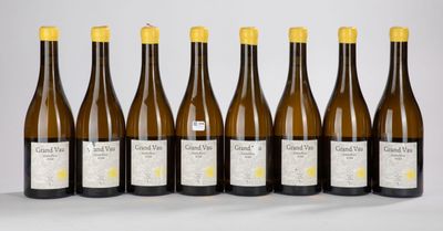 six bottles of white wine lined up in a row