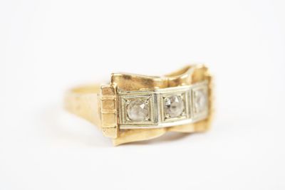 a close up of a gold ring with diamonds on a white background