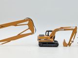 three toy construction vehicles that are on a white surface