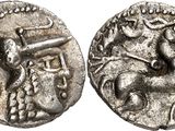 a silver coin with an image of a man on a horse