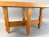 a small wooden table with two legs and a table top