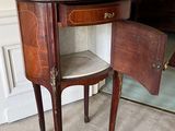 a small table with a drawer on top of it