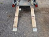 a trailer with a trailer attached to the back of it