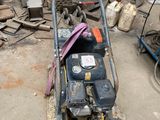 a lawn mower that is sitting on the ground