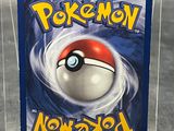 the pokemon card is in a clear plastic case