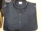 a blue shirt that is sitting on top of a table