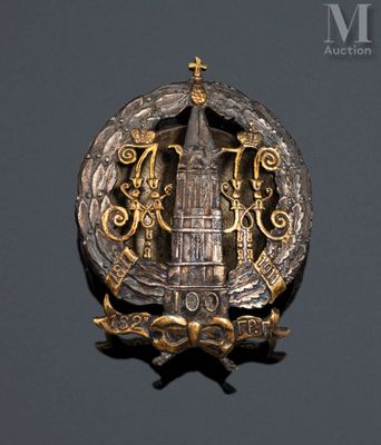a badge with a clock tower in the middle of it