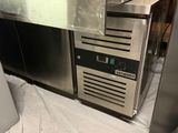 a stainless steel counter top with a microwave on it