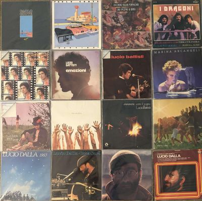 many different album covers on the table together