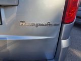 a close up of the rear end of a silver van