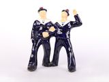 two figurines of a man and a woman standing next to each other