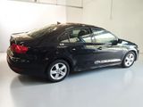 a picture of a black car parked in a garage
