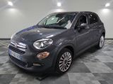 the grey fiat suv is parked on a checkered floor