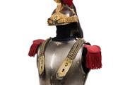 a silver and gold helmet with a red tassel on it