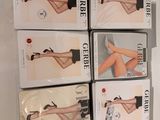 six pairs of women ' s stockings are stacked on top of each other