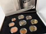 a box with a lot of different coins in it