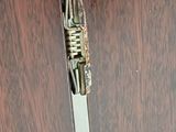 a wooden door with a metal latch on it