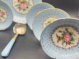 four plates and a spoon on a table