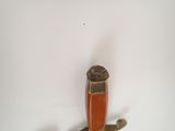 a small knife with a wooden handle on a white surface