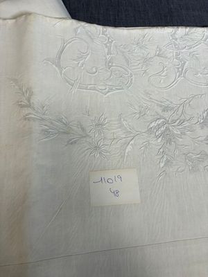 a piece of white fabric with a design on it