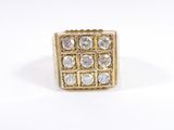an image of a gold and diamond ring on a white background