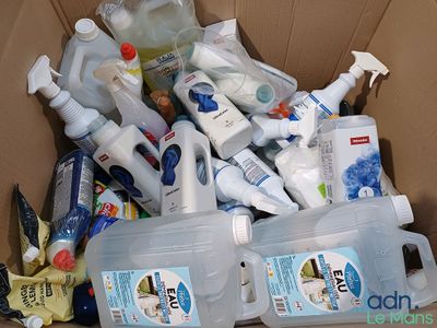 a cardboard box full of cleaning products and cleaning products