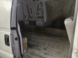 a white van that is parked in a garage