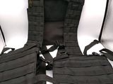 the back of a black vest with a harness attached to it
