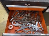 a drawer full of wrenches and other tools in it
