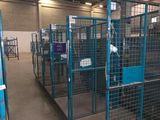 a large room with a lot of cages in it