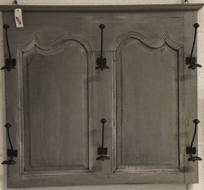 a picture of a cabinet with a mirror on the wall