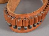 an image of a leather belt with a bunch of bullet shells on it