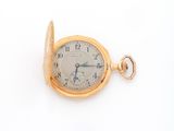pocket watch on a white surface with a white background