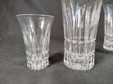 three clear glass vases sitting on a table