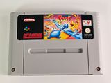 an old nintendo game is sitting on a white surface