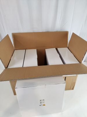 a cardboard box that has a bunch of white boxes inside of it