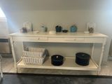 a white table with two baskets on top of it
